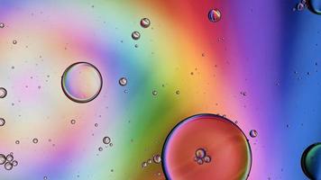 Abstract Colorful Food Oil Drops Bubbles and spheres Flowing on Water Surface, macro Videography video