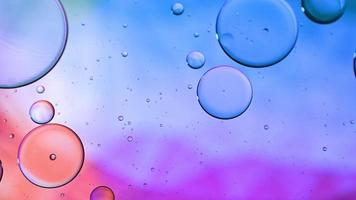 Abstract Colorful Food Oil Drops Bubbles and spheres Flowing on Water Surface, macro Videography video