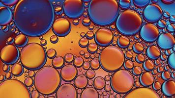 Abstract Colorful Food Oil Drops Bubbles and spheres Flowing on Water Surface, macro Videography video