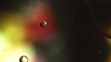 Abstract Colorful Food Oil Drops Bubbles and spheres Flowing on Water Surface, macro Videography video