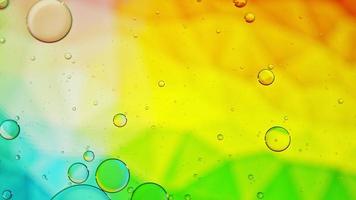 Abstract Colorful Food Oil Drops Bubbles and spheres Flowing on Water Surface, macro Videography video