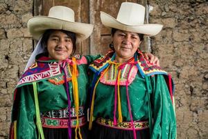 Peruvian andean womans posing in diferents actions photo