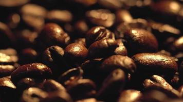 Macro shot of cup with hot coffee on roasted coffee beans in 4K video