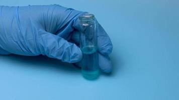 Taking a blue liquid is taken with a pipette from a small flask. The concept of medical research and development. video