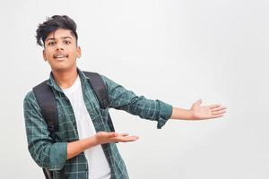 Young Indian college boy Showing Direction With Hand photo