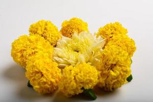 Marigold Flower rangoli Design with green leaf for traditional Festival. photo