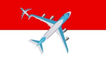 indonesiska flaggan och flygplan. animering av plan som flyger över Indonesiens flagga. begreppet flyg inom landet och utomlands. video