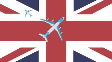 Britse vlag en vliegtuigen. animatie van vliegtuigen die over de vlag van groot-brittannië vliegen. concept van vluchten in binnen- en buitenland. video