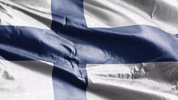 finland textiel vlag zwaaien op de wind-lus. Finse banner zwaaiend op de wind. stof textiel weefsel. volledige vulling achtergrond. 10 seconden lus. video