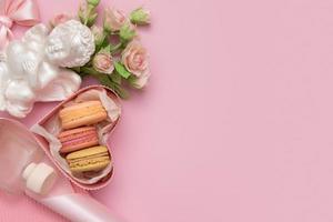 Valentines day flat lay with gift box macaroon, flowers photo