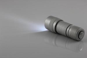 flashlight isolated on gray background photo