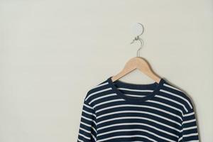 t-shirt hanging with wood hanger photo