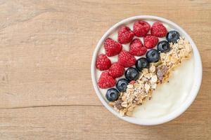 homemade yogurt bowl with raspberry, blueberry and granola photo