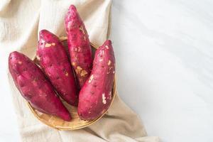 Japanese sweet potatoes on basket photo