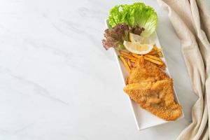 fish and chips - fried fish fillet with potatoes chips photo