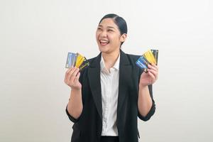 Asian woman holding credit card with white background photo