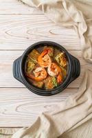 Sour soup made of Tamarind Paste with Shrimps and Vegetable Omelet photo