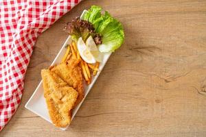 fish and chips - fried fish fillet with potatoes chips photo