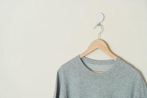 t-shirt hanging with wood hanger photo