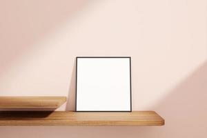Minimalist and clean square black poster or photo frame mockup on the wooden table leaning against the room wall