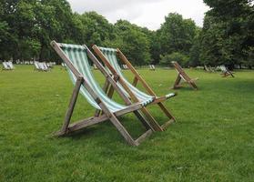 deckchairs in a park photo