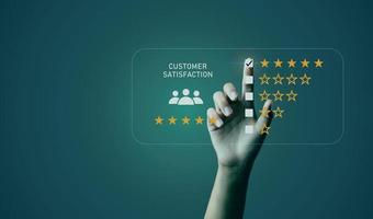 Businessman's hand pointing to customer satisfaction survey Users rate the service experience on the online application. Customers can assess the quality of service leading photo