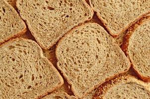 Bread background of sliced cereal bread. photo