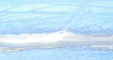 Abstract winter background.Frozen river on a sunny winter day. photo