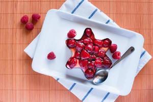 raspberry cake on porcelain plate photo