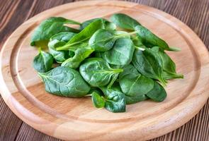 Fresh spinach on the wooden board