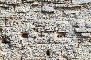 Fragment of an ancient medieval fortress wall photo