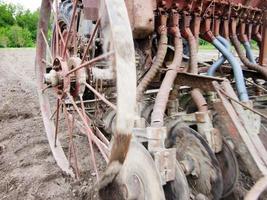 Plowed field by tractor in brown soil on open countryside nature photo