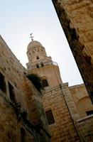 Christian church cross in high steeple tower for prayer photo