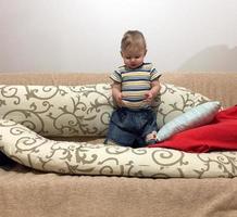 Beautiful baby boy with child face posing photographer photo