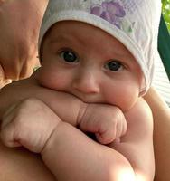 Beautiful baby boy with child hat posing photographer for color photo