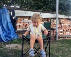 Beautiful baby boy with child face posing photographer photo