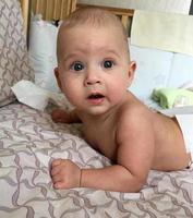 Beautiful baby boy with child face posing photographer photo