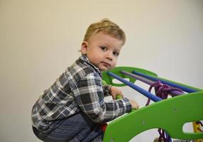 Beautiful baby boy with child face posing photographer photo