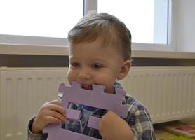 Beautiful baby boy with child face posing photographer photo