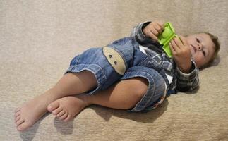 Beautiful baby boy with child face posing photographer photo