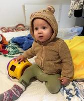 Beautiful baby boy with child face posing photographer photo