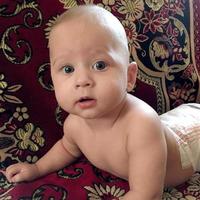 Beautiful baby boy with child face posing photographer photo