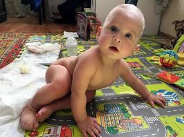 Beautiful baby boy with child face posing photographer photo