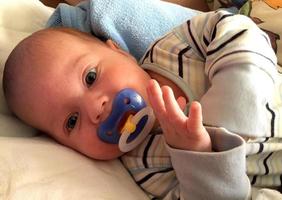 Beautiful baby boy with child face posing photographer photo