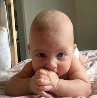 Beautiful baby boy with child face posing photographer photo