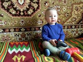 Beautiful baby boy with child face posing photographer photo