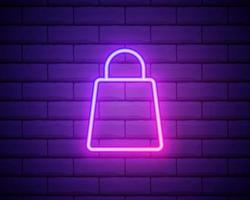 Shopping bag with handles. Shopping cart in the online store. Neon Linear Design Element. Glowing vector sign isolated on brick wall