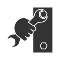 Hand holding wrench glyph icon. Silhouette symbol. Double open ended spanner turning bolt. Negative space. Vector isolated illustration