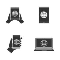 Internet connection glyph icons set. Hand holding tablet pc, smartphone and laptop with globe. Silhouette symbols. Vector isolated illustration