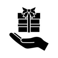 icono de glifo actual. símbolo de la silueta. mano abierta con caja de regalo. dar, recibir regalo. espacio negativo. ilustración vectorial aislada